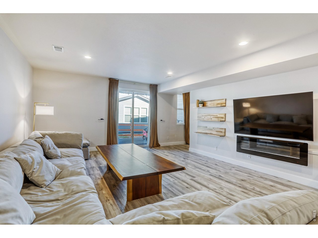 7154 Howell Street Arvada, CO 80004 - Photo 20 of 36 Lower Level Family Room w/Fireplace