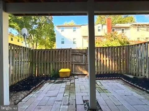 a view of a room with wooden floor and a swing