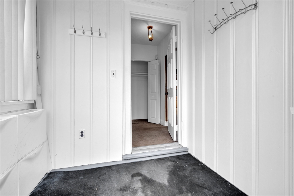 18 Butler Street Revere, MA 02151 - Photo 24 of 33 a view of a hallway with wooden floor and entryway