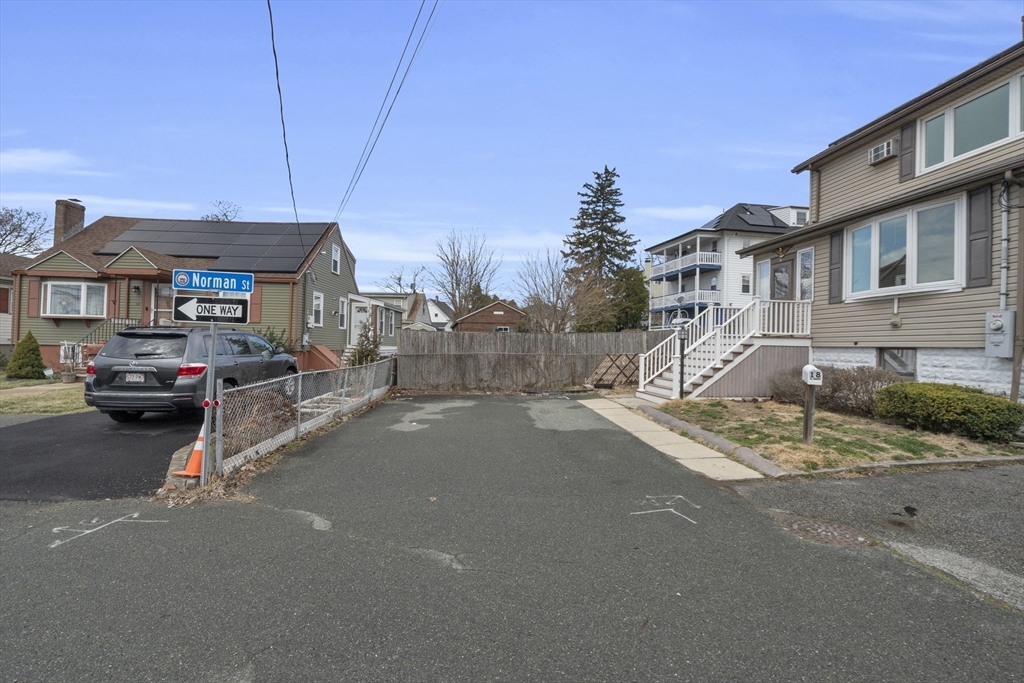 18 Butler Street Revere, MA 02151 - Photo 26 of 33 a couple of cars parked in front of a house