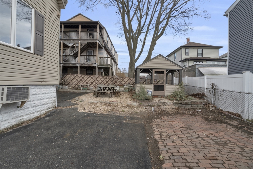 18 Butler Street Revere, MA 02151 - Photo 29 of 33 a front view of a house with a yard