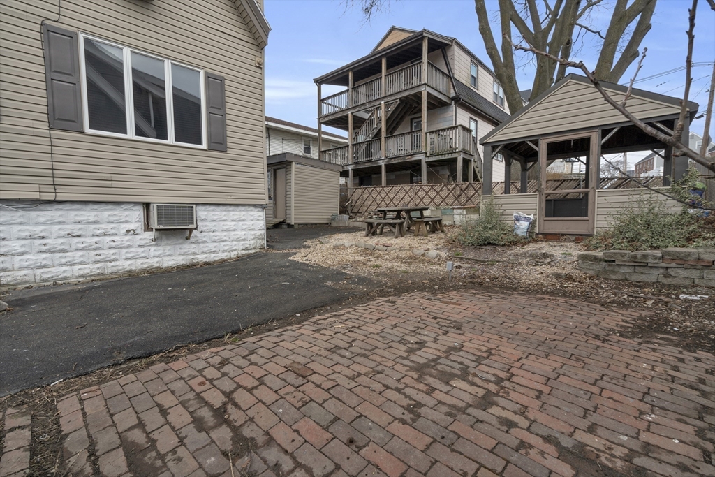 18 Butler Street Revere, MA 02151 - Photo 30 of 33 a front view of a house with a yard