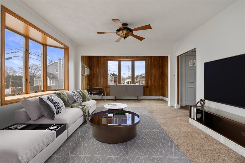 18 Butler Street Revere, MA 02151 - Photo 3 of 33 a living room with furniture and a flat screen tv