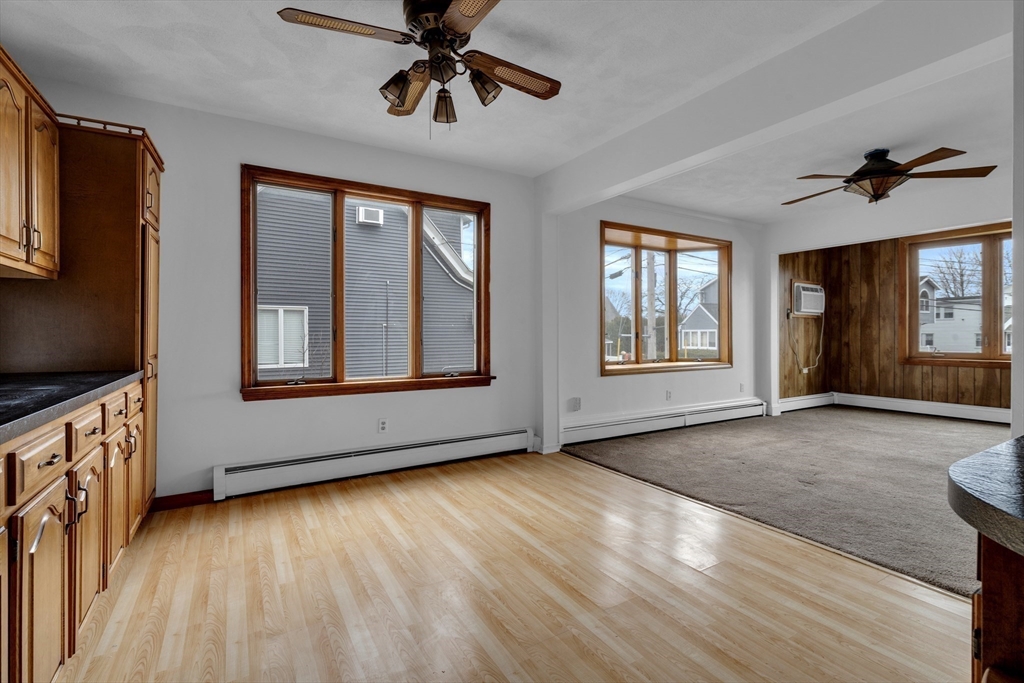 18 Butler Street Revere, MA 02151 - Photo 4 of 33 a view of an empty room with a window and wooden floor