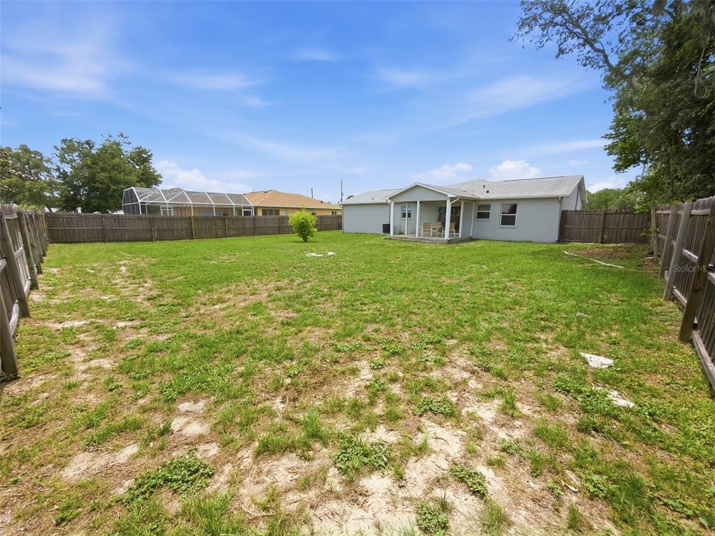 2202 Godfrey Avenue Spring Hill, FL 34609 - Photo 32 of 36 a view of a house with a yard