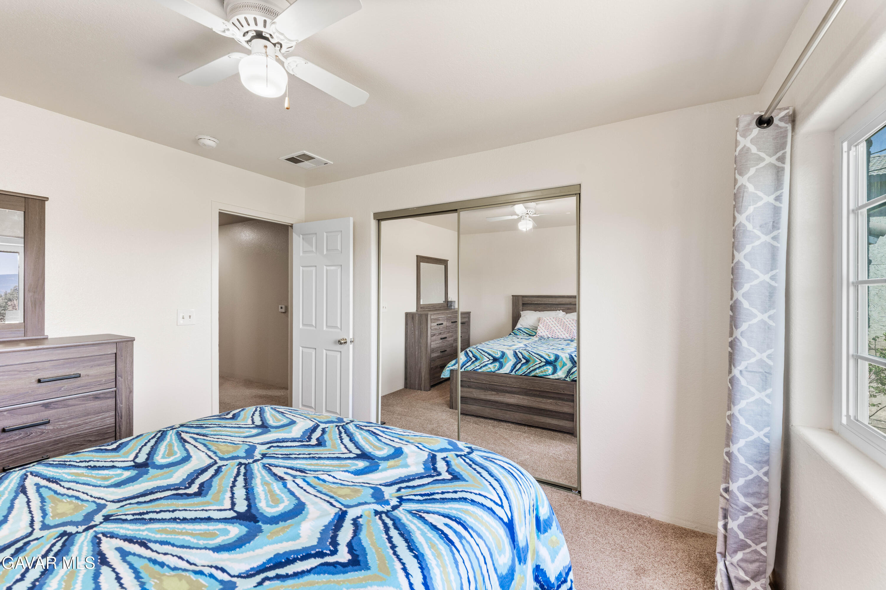 13275 Boy Scout Camp Road Frazier Park, CA 93225 - Photo 55 of 90 a bedroom with a bed and a chandelier