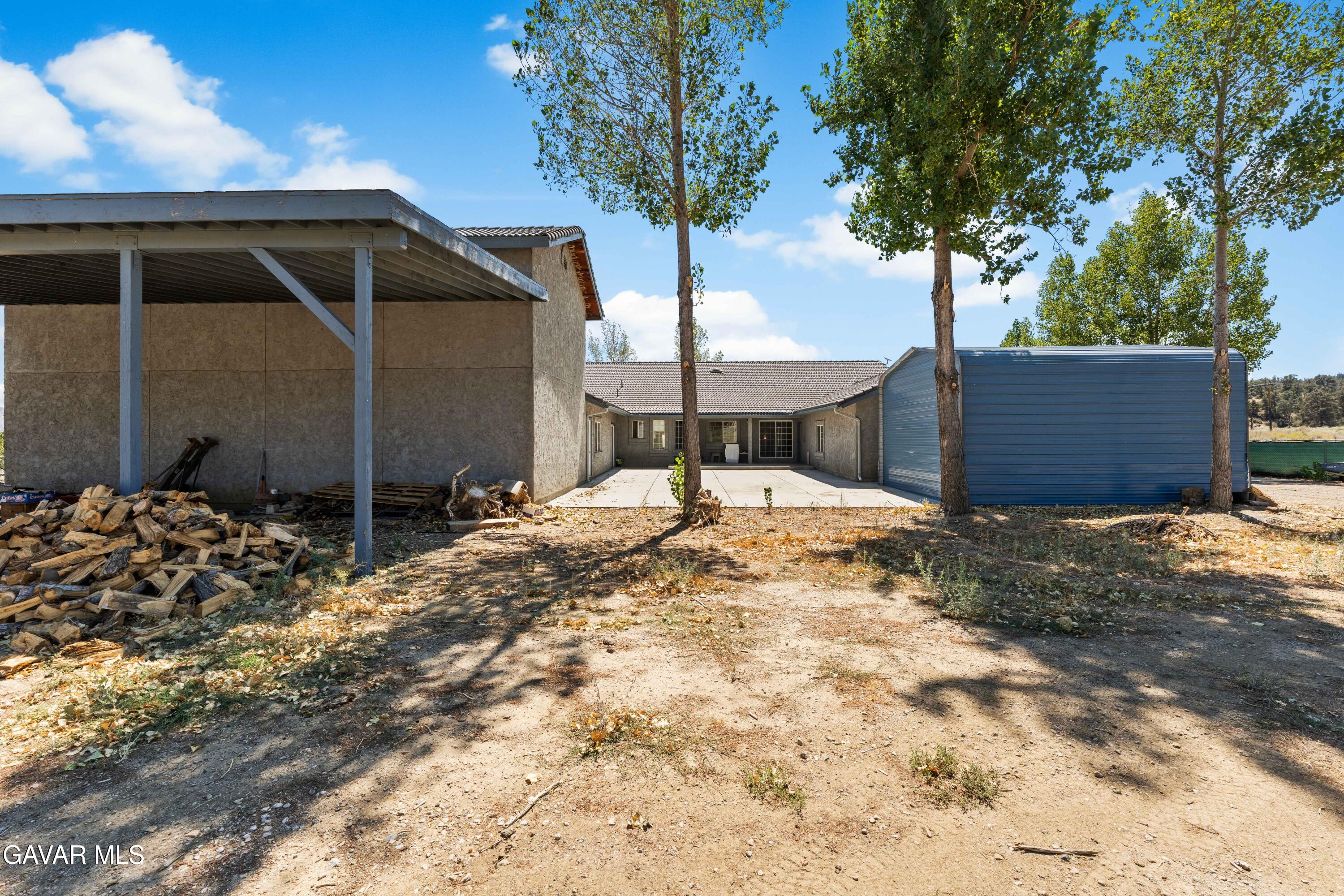13275 Boy Scout Camp Road Frazier Park, CA 93225 - Photo 66 of 90 a backyard of a house with table and chairs