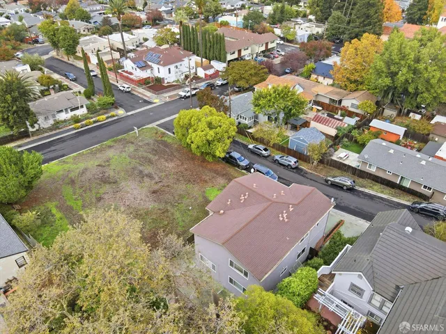 an aerial view of a house with a garden