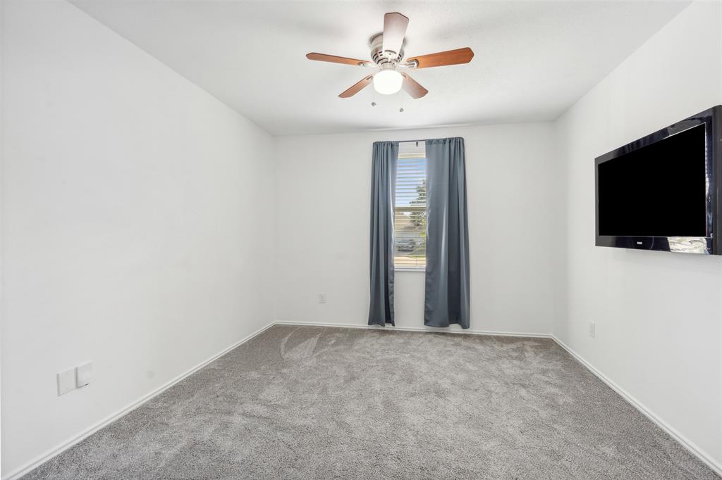 3804 McClintick Road McKinney, TX 75070 - Photo 17 of 32 a view of a livingroom with a flat screen tv