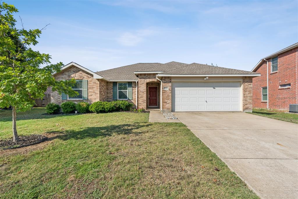 3804 McClintick Road McKinney, TX 75070 - Photo 2 of 32 a front view of a house with a yard and garage