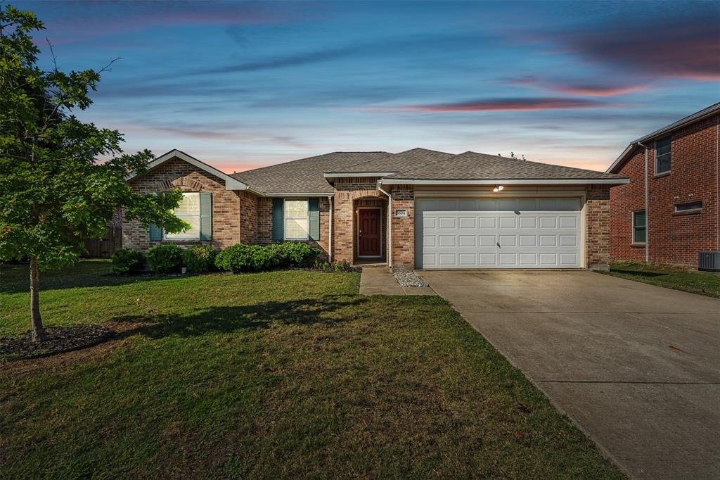 3804 McClintick Road McKinney, TX 75070 - Photo 3 of 32 a front view of a house with a yard and garage