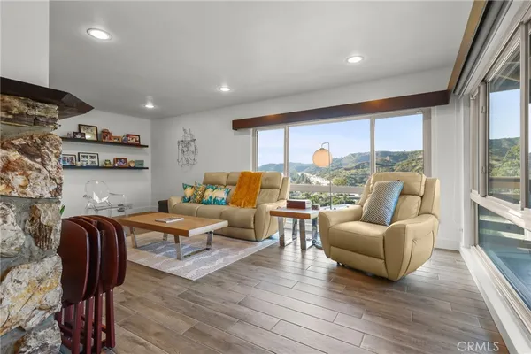 a living room with furniture and a large window