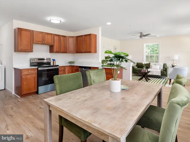 a kitchen with a stove a sink and a refrigerator