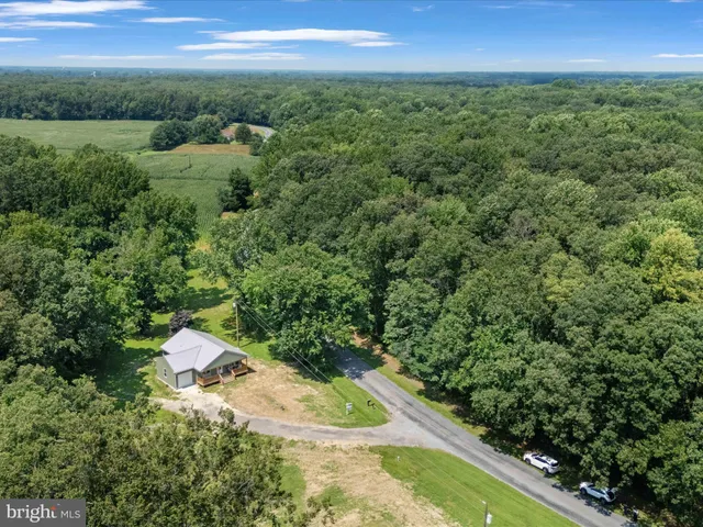 a view of a field with an ocean