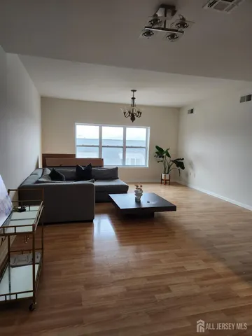 a kitchen with stainless steel appliances a stove a sink and a refrigerator