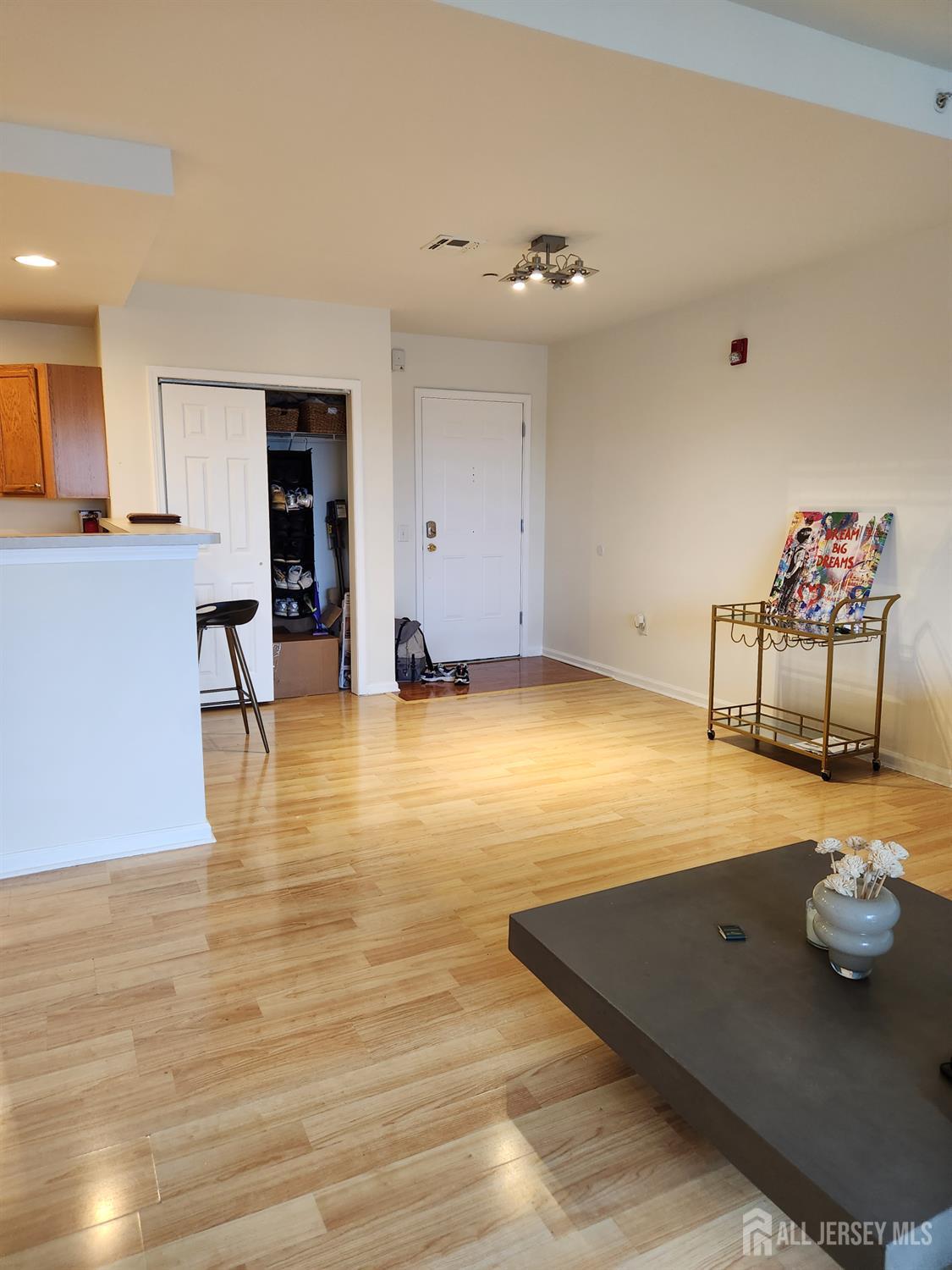 358 Rector Street, Unit 705 Perth Amboy, NJ 08861 - Photo 4 of 11 a room with gym equipment and a table