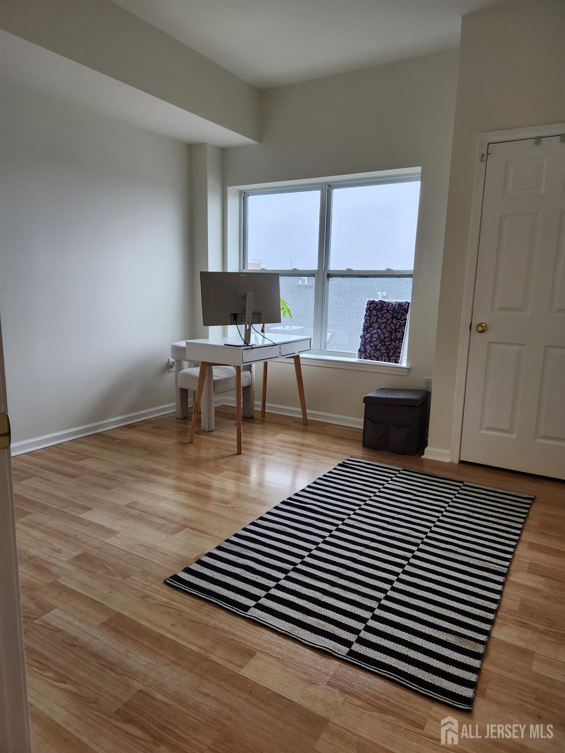 358 Rector Street, Unit 705 Perth Amboy, NJ 08861 - Photo 7 of 11 a living room with furniture and a rug