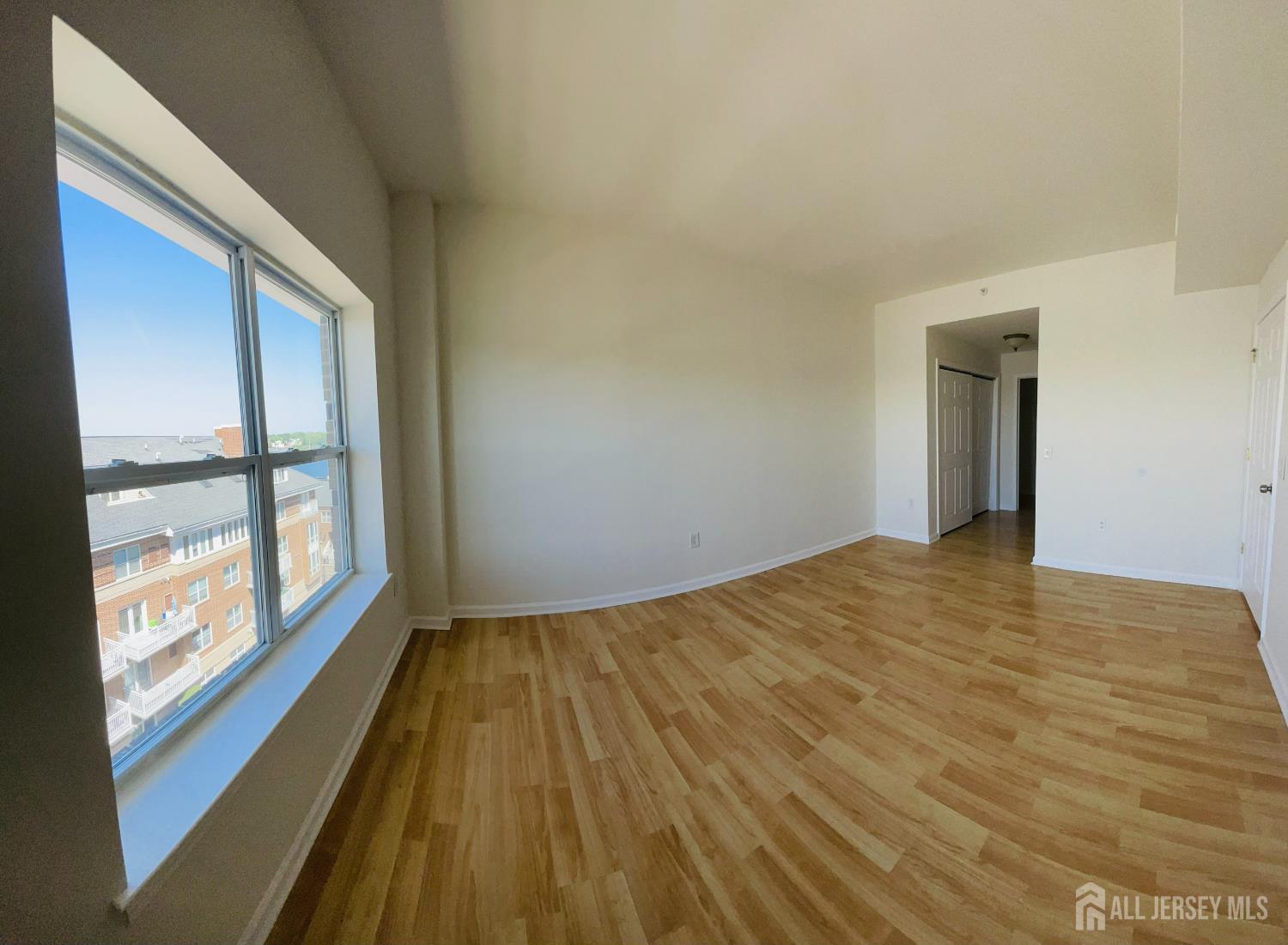 358 Rector Street, Unit 705 Perth Amboy, NJ 08861 - Photo 8 of 11 a view of an empty room and window
