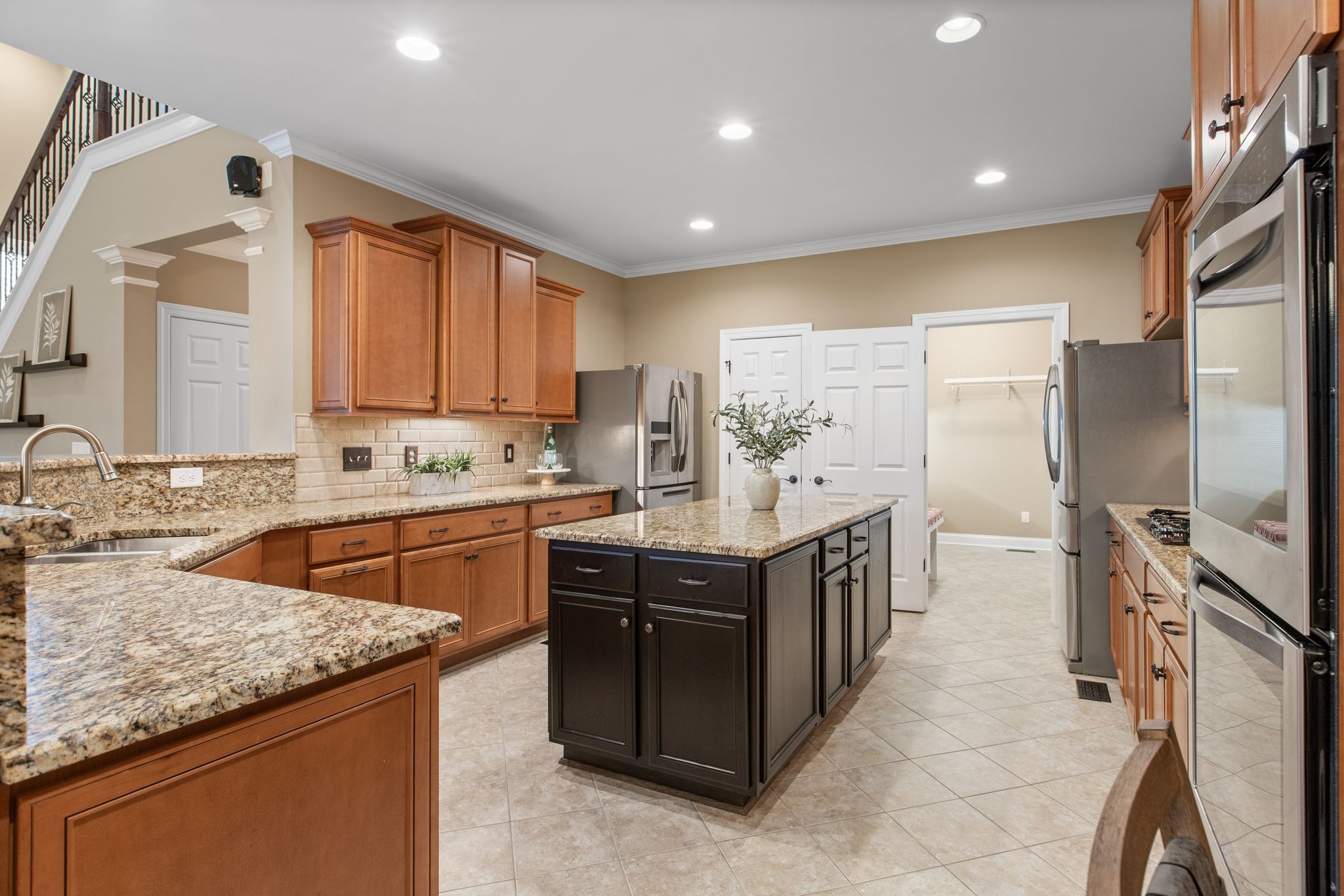161 Chester Stevens Road Franklin, TN 37067 - Photo 11 of 37 a kitchen with stainless steel appliances granite countertop a sink stove and refrigerator