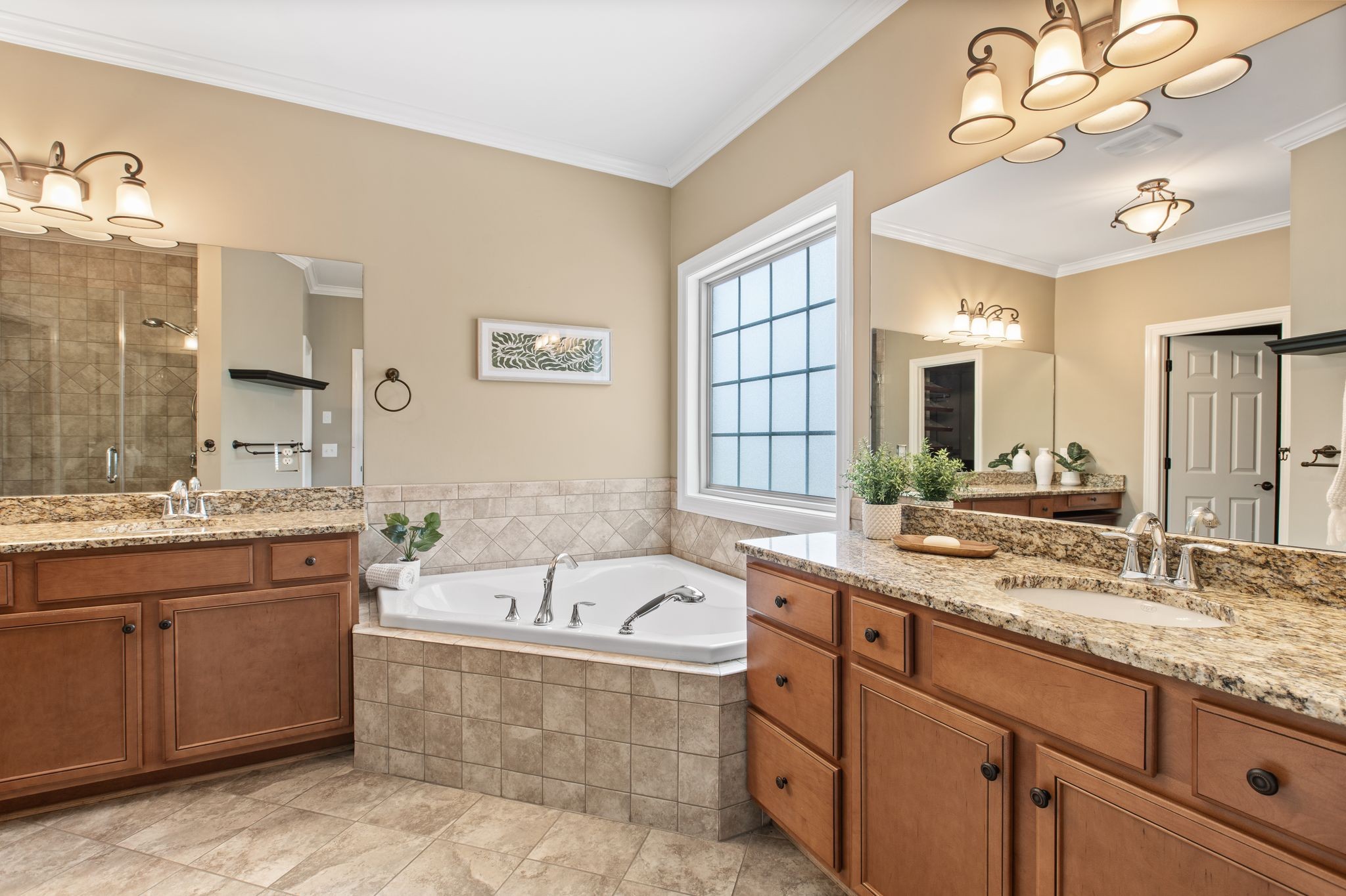 161 Chester Stevens Road Franklin, TN 37067 - Photo 17 of 37 a bathroom with a granite countertop double vanity sink a mirror and a bathtub