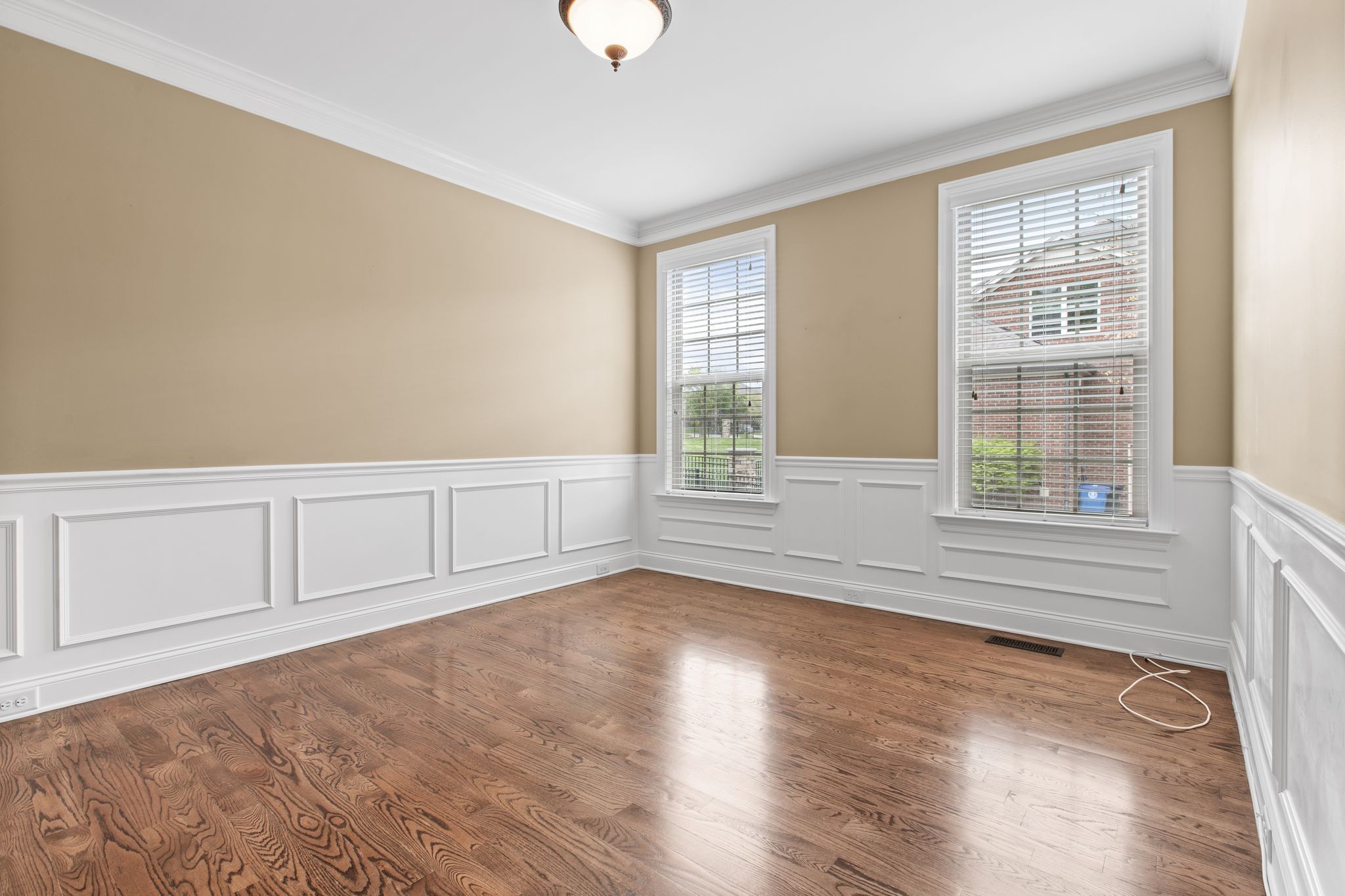 161 Chester Stevens Road Franklin, TN 37067 - Photo 21 of 37 a view of an empty room with a window and wooden floor