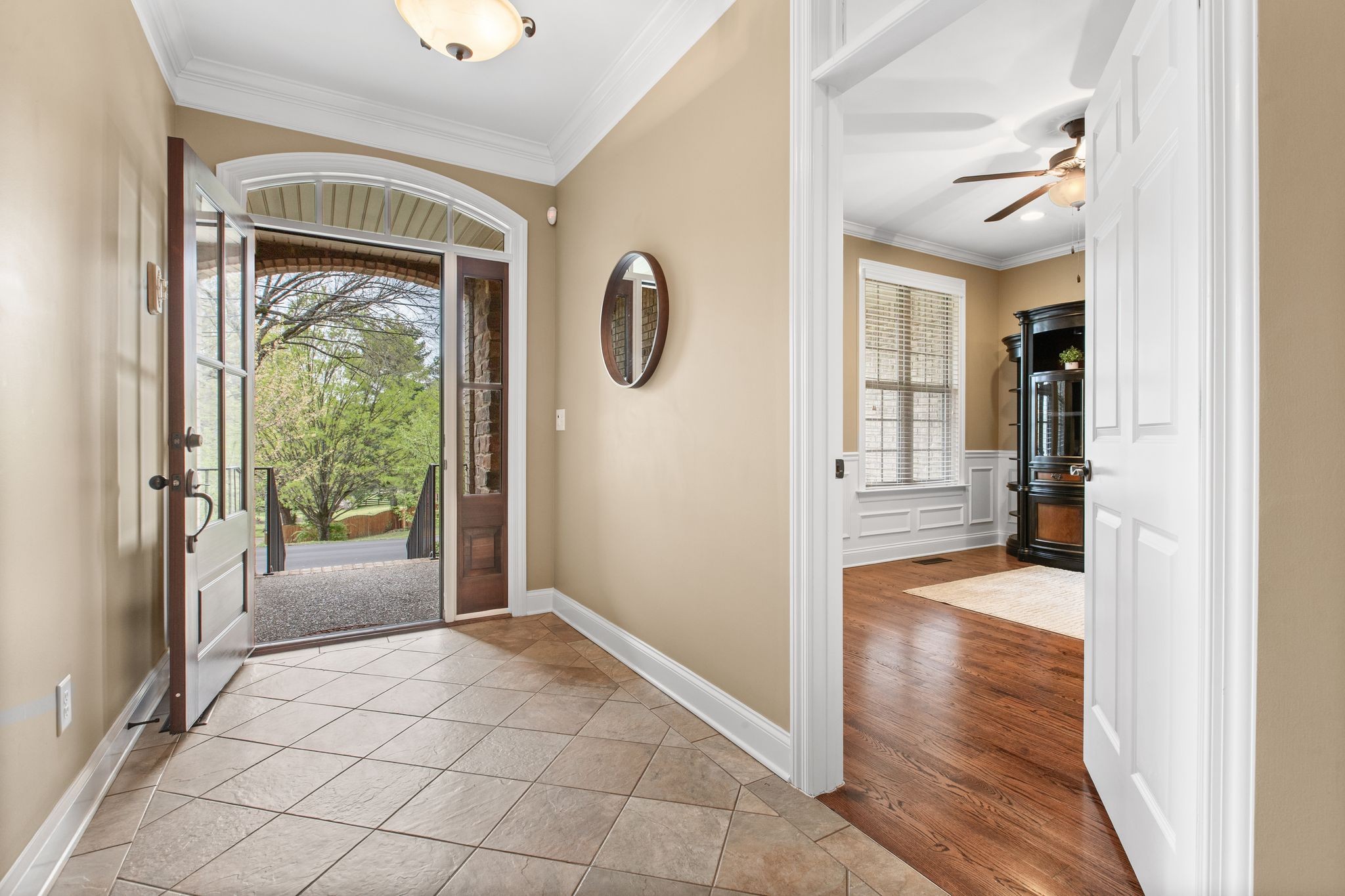 161 Chester Stevens Road Franklin, TN 37067 - Photo 4 of 37 a view of a hallway with wooden floor and windows