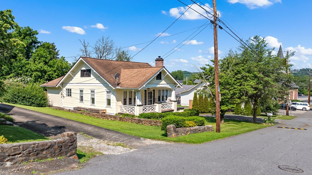 46 Dillard Street Murphy, NC 28906 - Photo 11 of 73 a front view of a house with a yard and potted plants