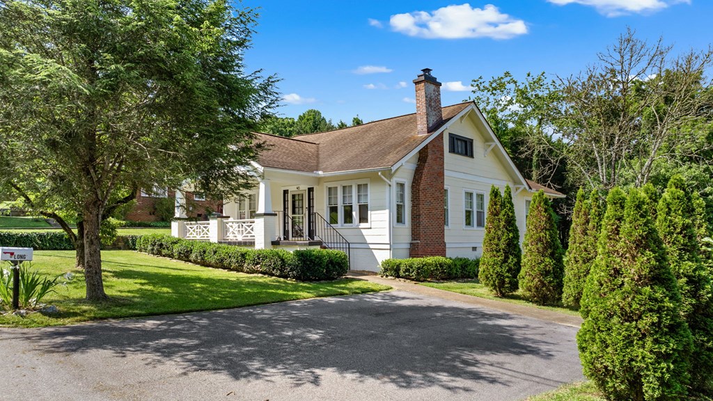 46 Dillard Street Murphy, NC 28906 - Photo 21 of 73 a view of a brick house next to a yard with big trees