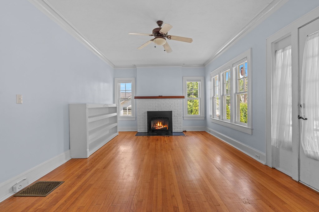 46 Dillard Street Murphy, NC 28906 - Photo 44 of 73 a view of an empty room with wooden floor fireplace and a window