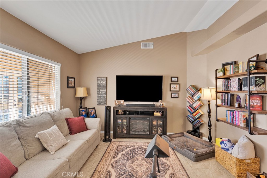 20403 Ochoa Road Apple Valley, CA 92307 - Photo 15 of 48 a living room with furniture and a flat screen tv