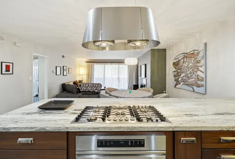 a kitchen with a stove and cabinets