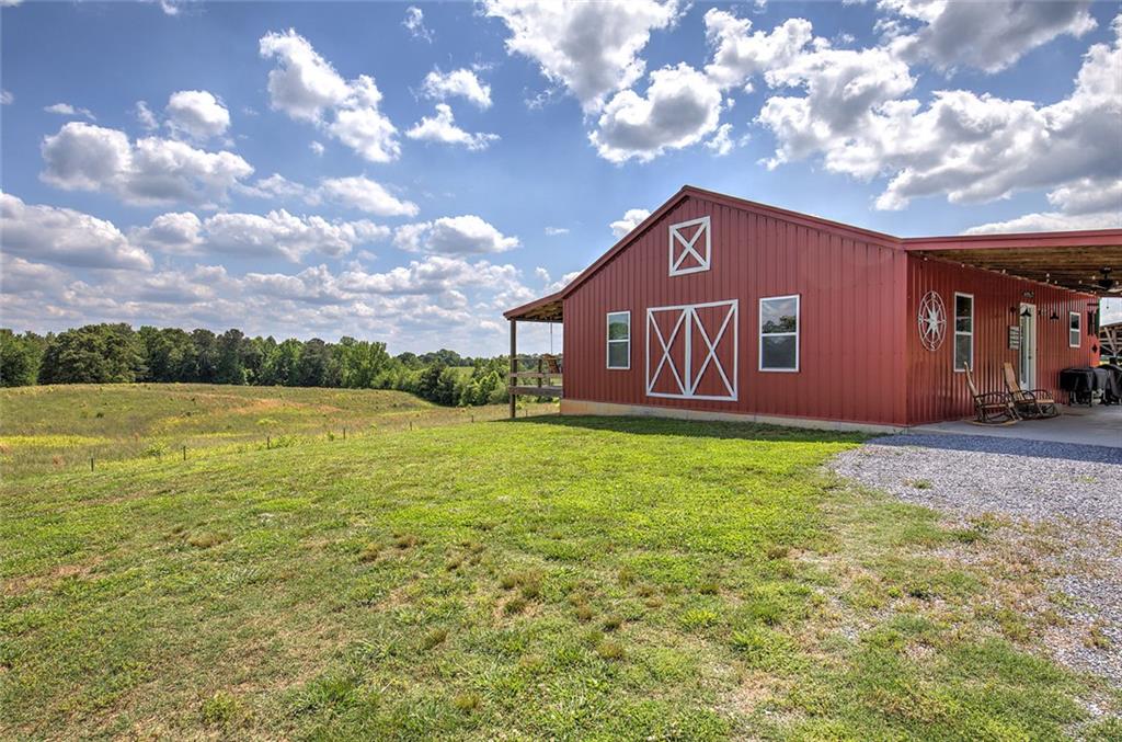 765 Addison Road Buchanan, GA 30113 - Photo 26 of 50 a view of a house with a yard
