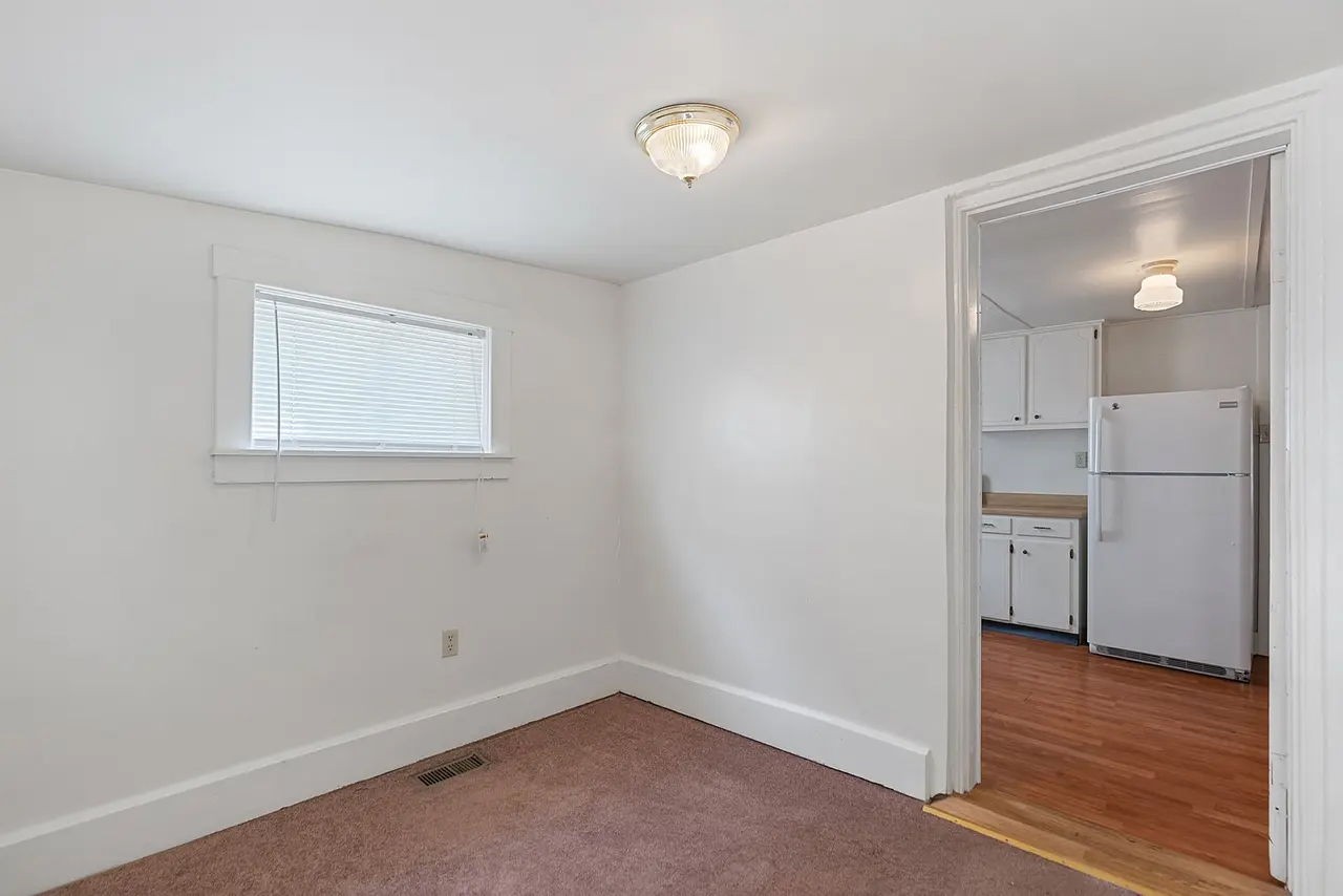 702 Richard Street Springfield, TN 37172 - Photo 13 of 15 a view of empty room with wooden floor and window