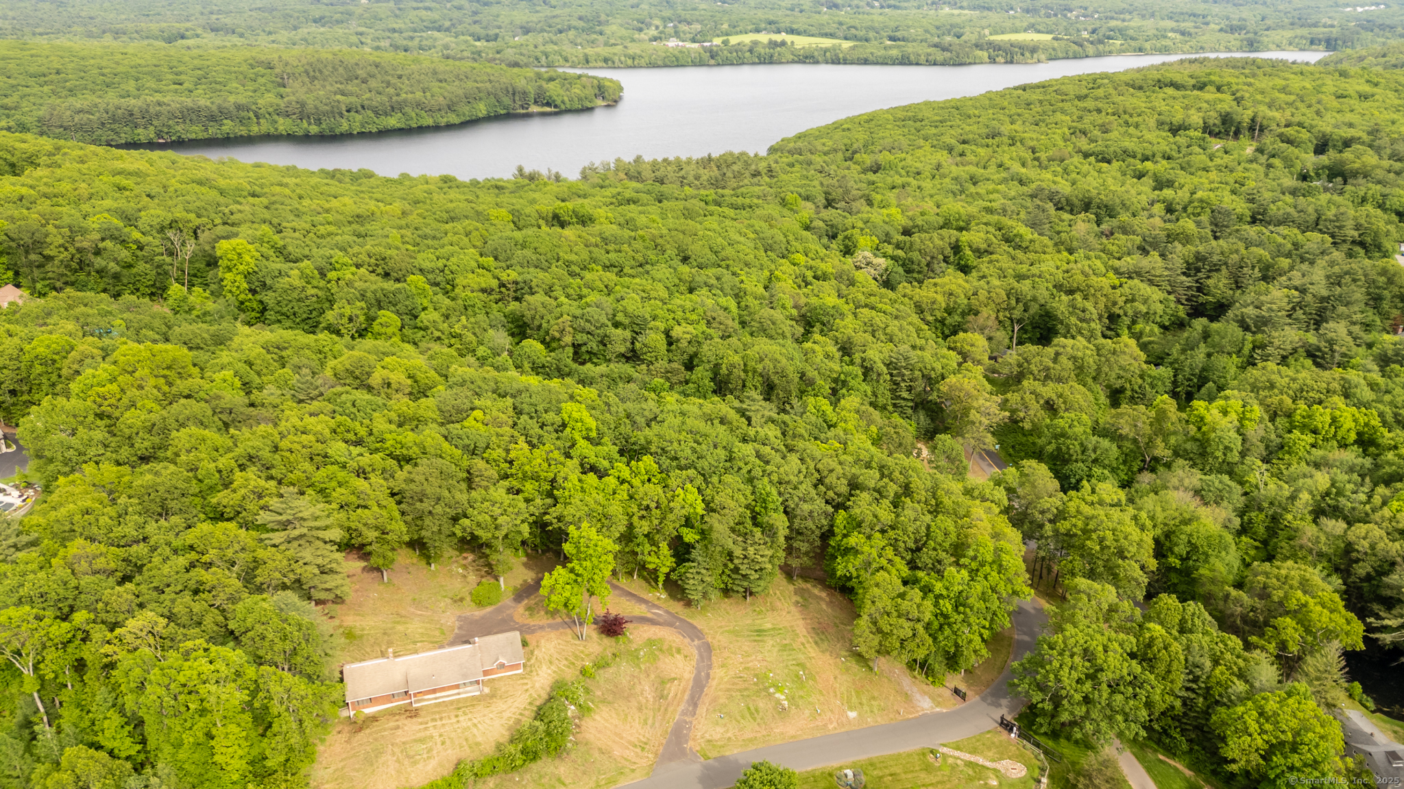 2 Setting Sun Trail Ellington, CT 06029 - Photo 7 of 7 a view of a yard with an outdoor space