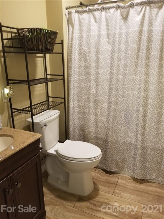 5357 Old Beatty Ford Road Rockwell, NC 28138 - Photo 13 of 14 a bathroom with a toilet and shower