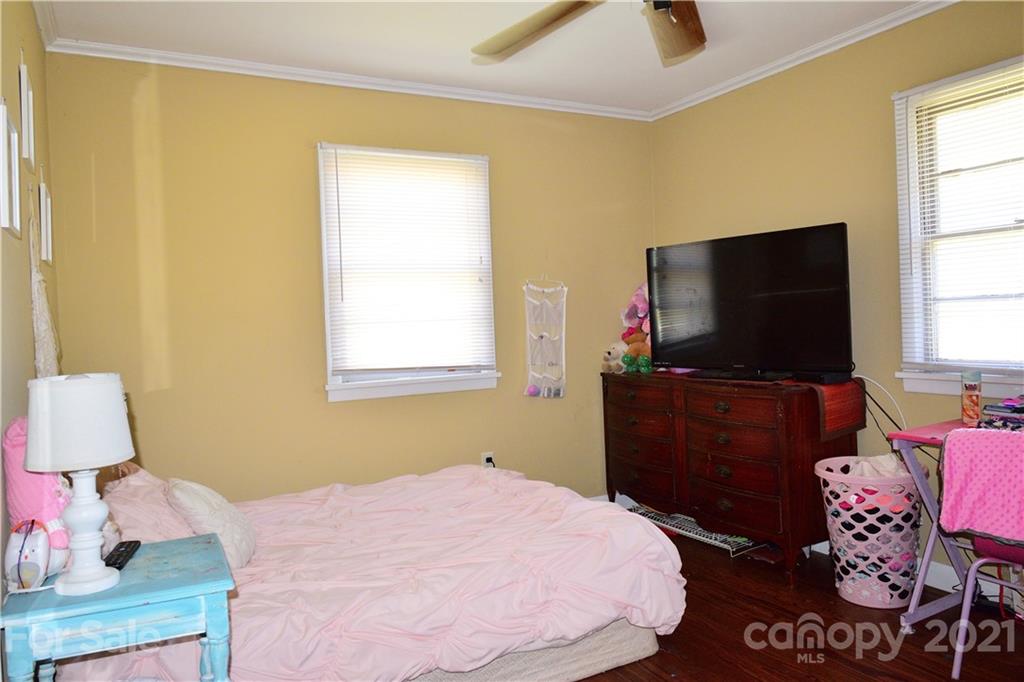 5357 Old Beatty Ford Road Rockwell, NC 28138 - Photo 14 of 14 a bedroom with a bed and flat screen tv