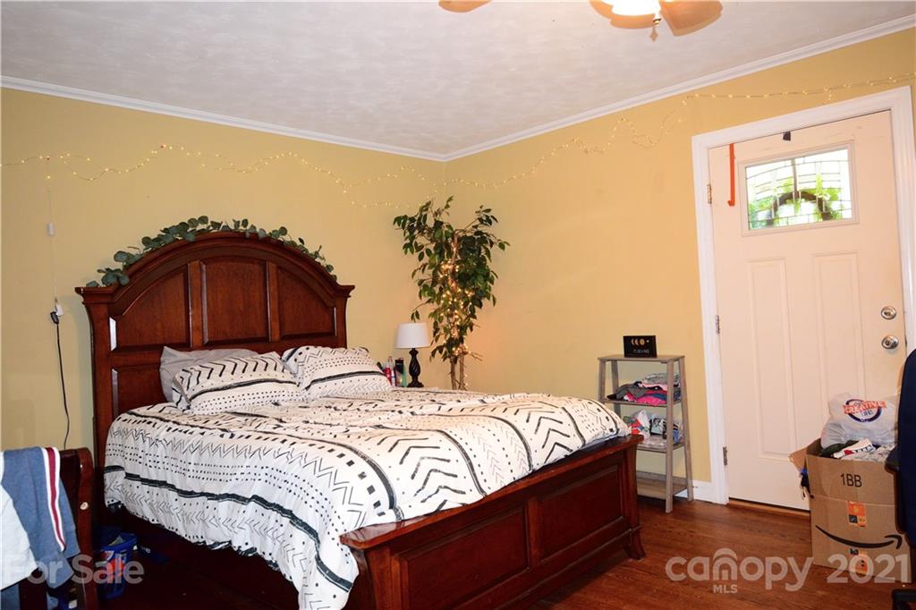 5357 Old Beatty Ford Road Rockwell, NC 28138 - Photo 10 of 14 a bedroom with a bed and a closet with wooden floor