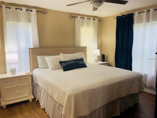 a bedroom with a bed and a window