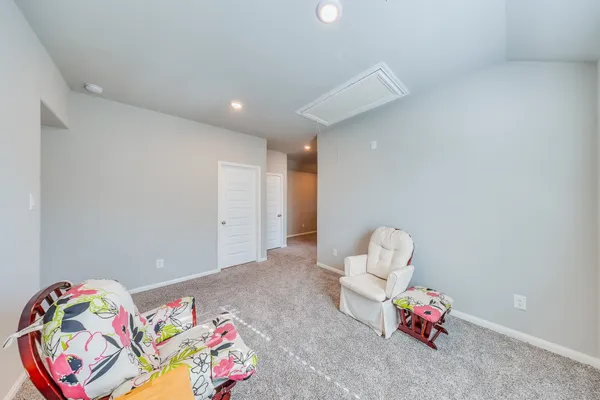 a bedroom with toys and a couch