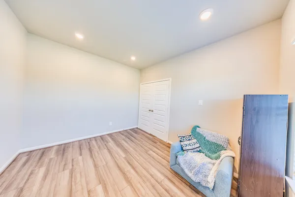 a view of workspace room with wooden floor