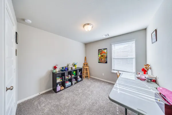 a living room with furniture and a table