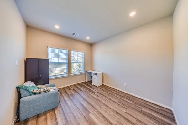 a living room with furniture and windows