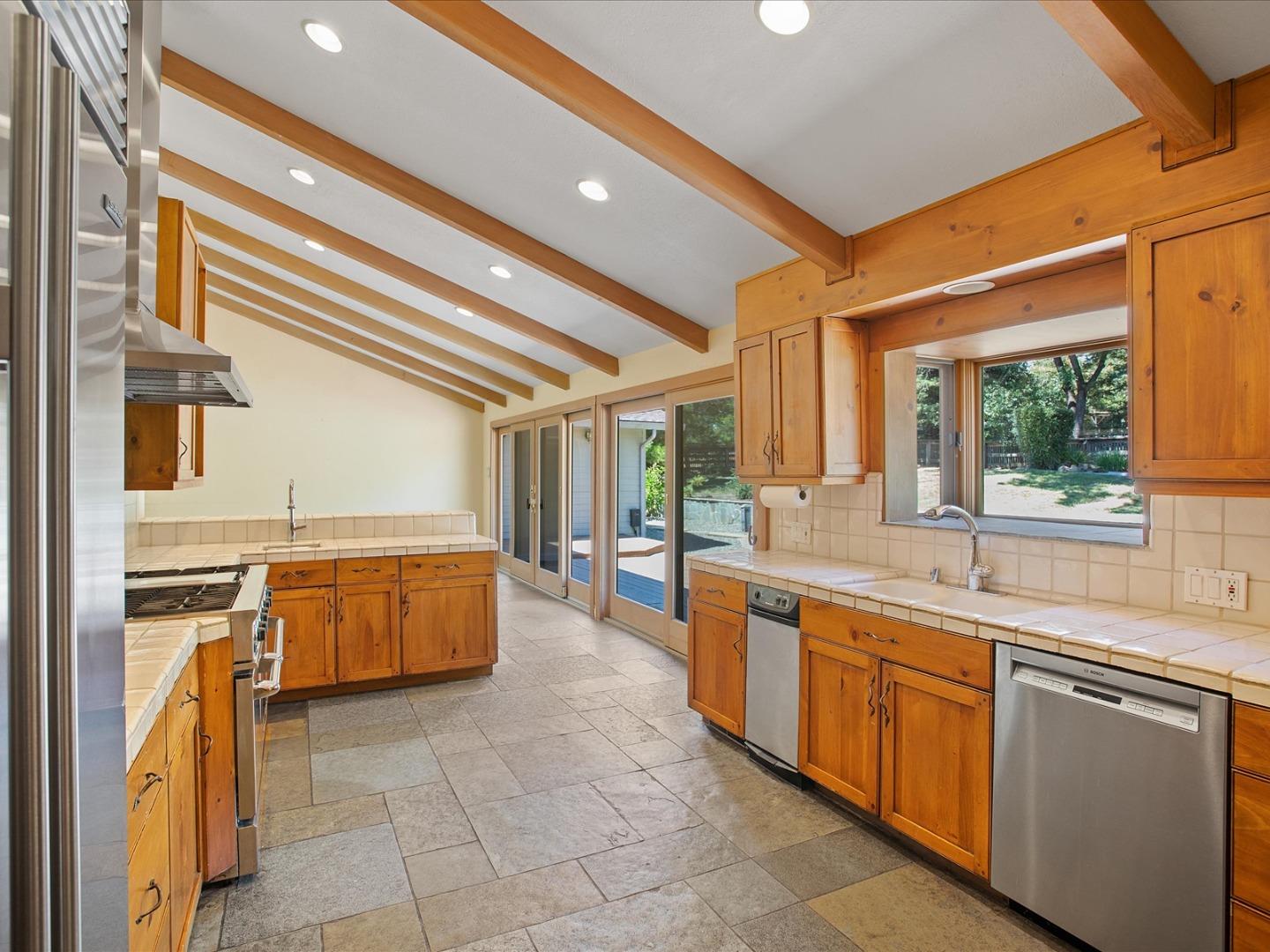 1395 Cañada Road Woodside, CA 94062 - Photo 4 of 36 a large kitchen with a large window