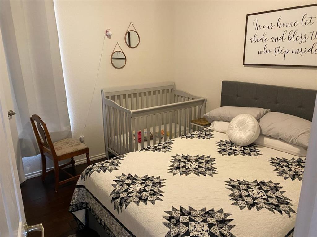 3817 Summersville Lane Fort Worth, TX 76244 - Photo 7 of 18 a bed sitting in a bedroom next to a window