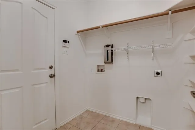 a bathroom with a bathtub and a window