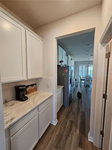 a bedroom with a bed and a cabinets