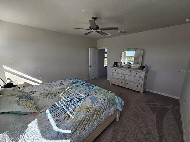 a view of roof deck with two chair and a potted plant