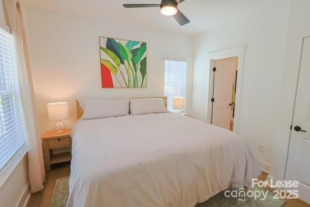 2136 Caldera Street Charlotte, NC 28208 - Photo 22 of 25 a bedroom with a bed and a painting on the wall