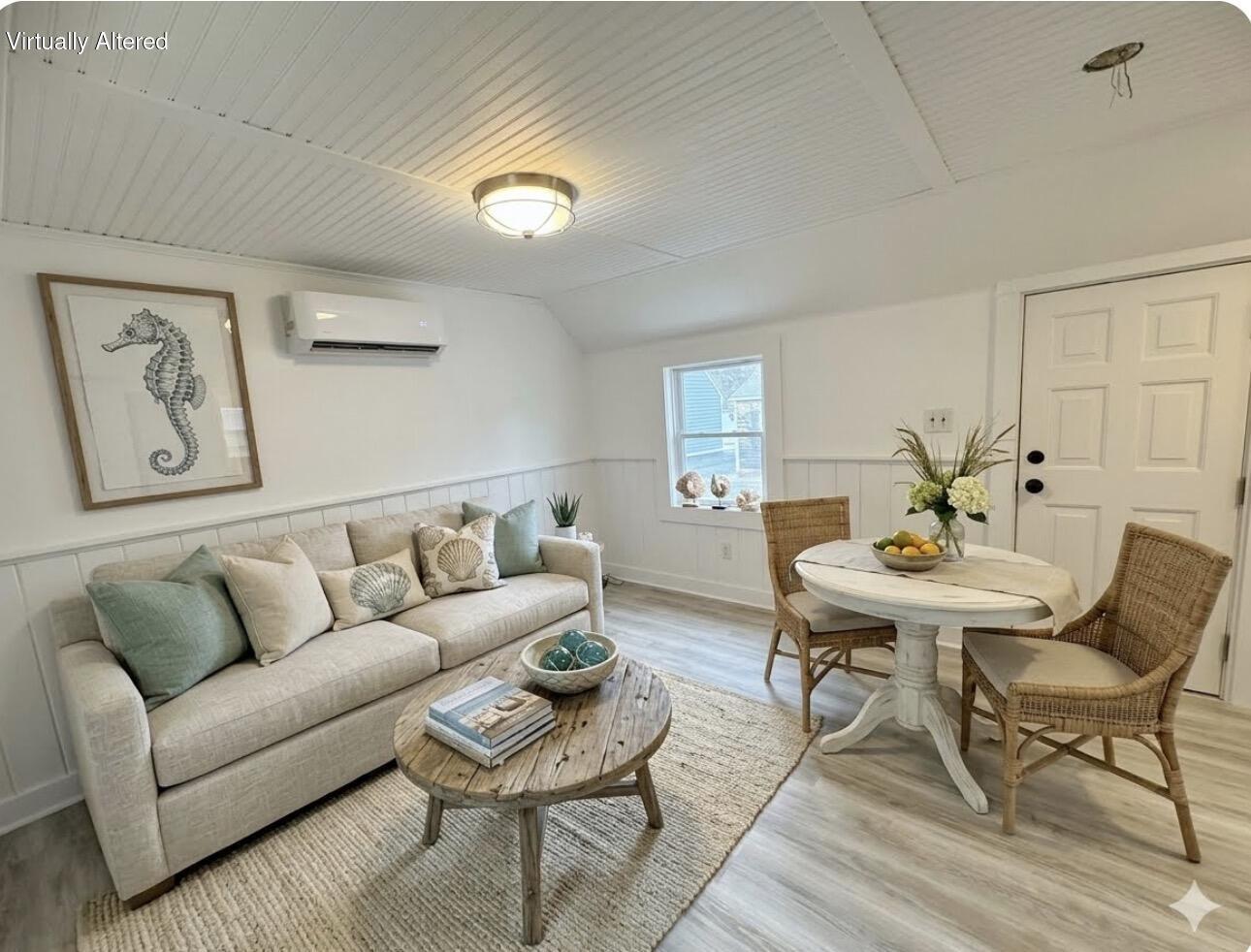 376 Route 6A, Unit 6 Sandwich, MA 02537 - Photo 1 of 6 a living room with furniture and a wooden floor