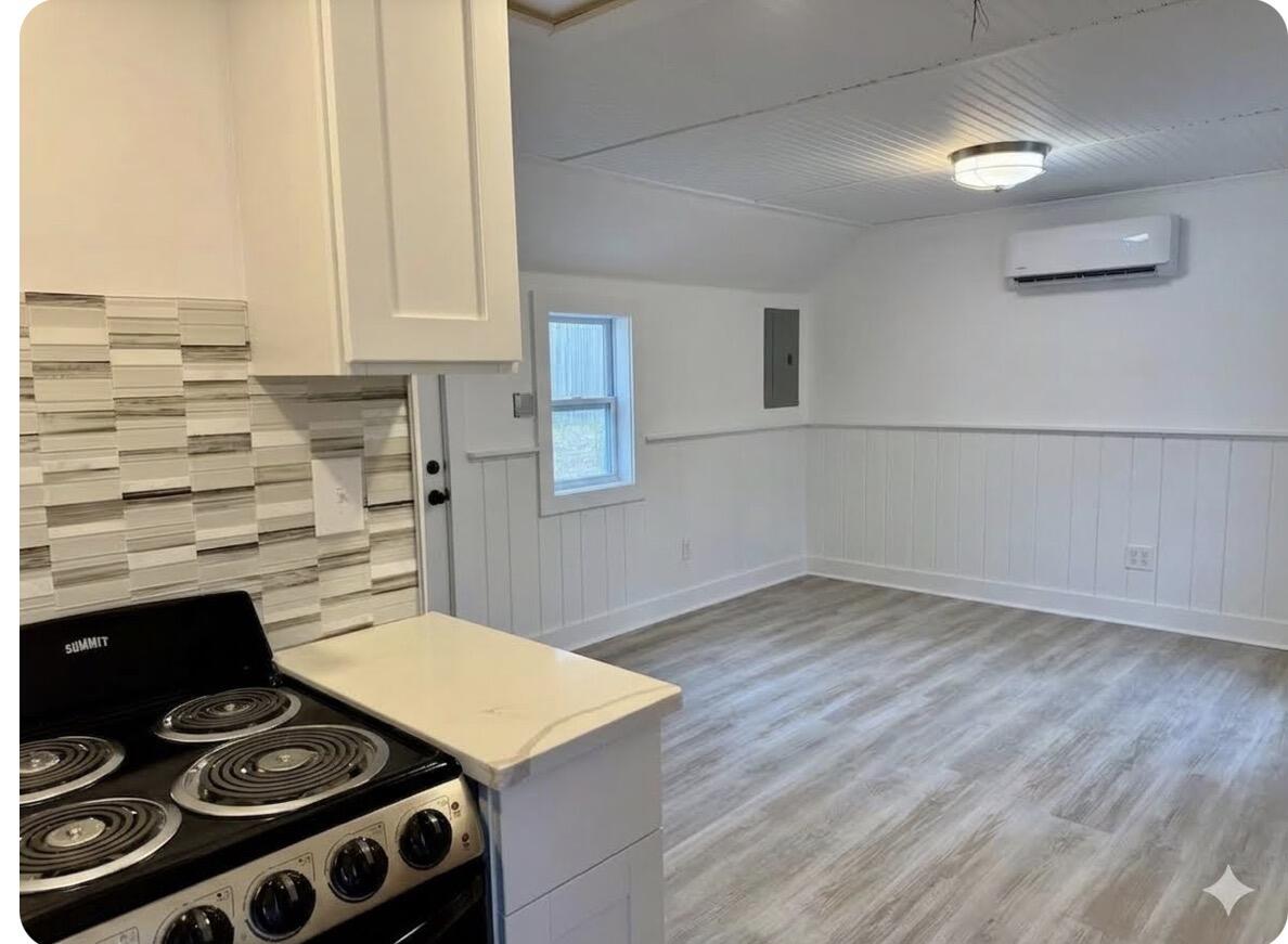 376 Route 6A, Unit 6 Sandwich, MA 02537 - Photo 4 of 6 a kitchen with a stove and a microwave